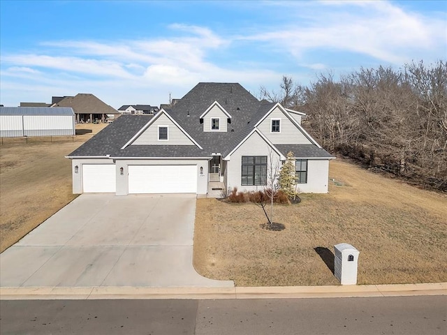 view of front facade with a front yard and a garage