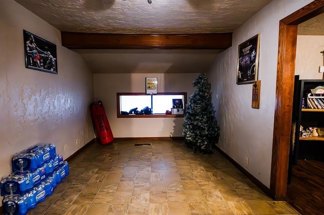 interior space featuring lofted ceiling with beams