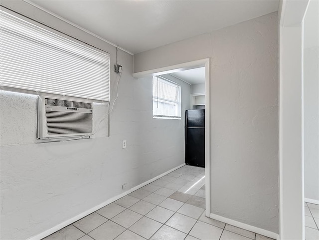 unfurnished room featuring light tile patterned floors