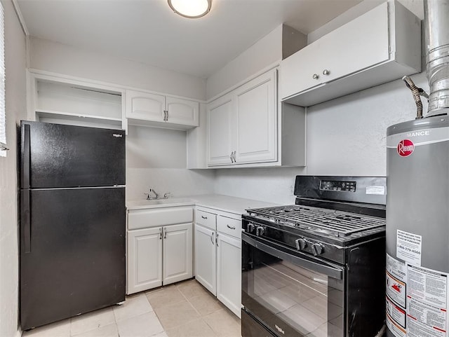 kitchen featuring light tile patterned flooring, sink, gas water heater, black appliances, and white cabinets