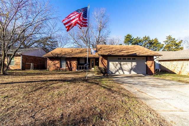 single story home featuring a front yard and a garage