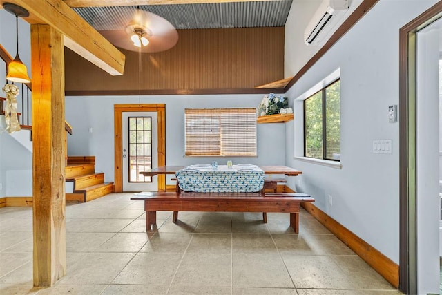 interior space with a wall mounted AC, ceiling fan, and a patio area