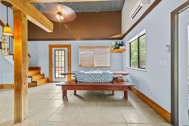 49900 W 201st St, Depew, OK 74028 - sitting room with a wall unit AC, stairway, light tile patterned floors, and a ceiling fan