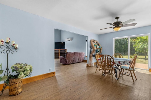 dining space with ceiling fan and wood-type flooring