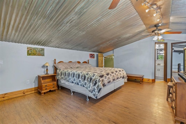 bedroom with ceiling fan, light hardwood / wood-style flooring, and wooden ceiling