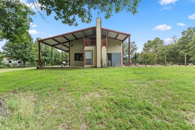 view of outdoor structure featuring a lawn