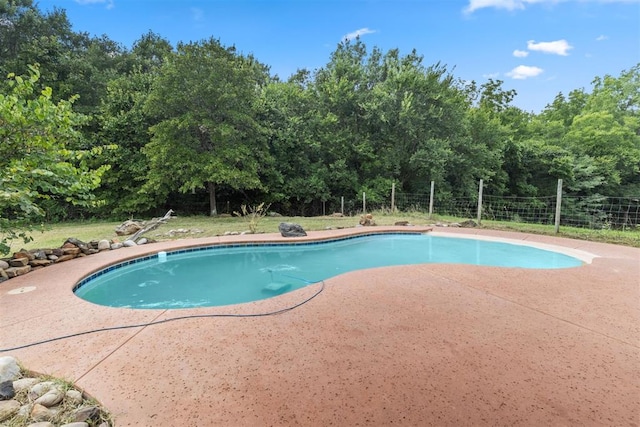 49900 W 201st St, Depew, OK 74028 - view of swimming pool featuring a patio area and view of wooded area