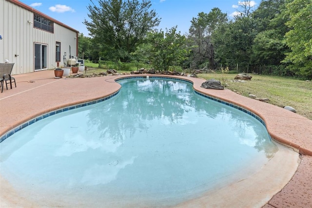49900 W 201st St, Depew, OK 74028 - outdoor pool featuring a patio, a yard, and view of wooded area