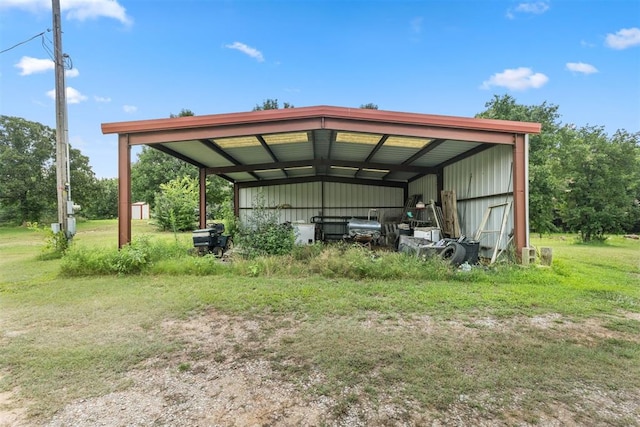 view of vehicle parking with a yard