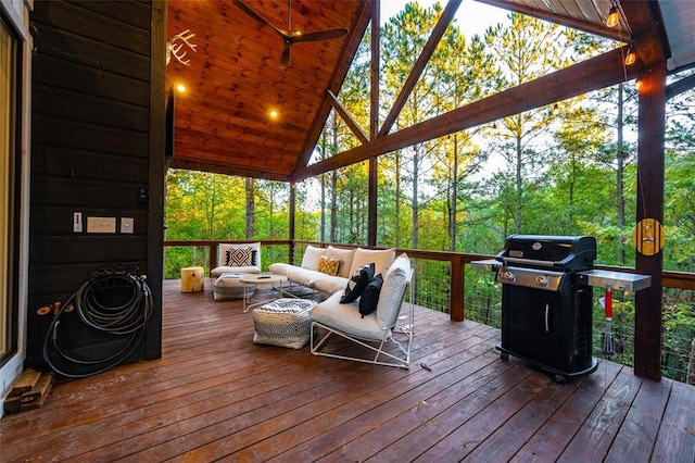 deck with outdoor lounge area and a grill