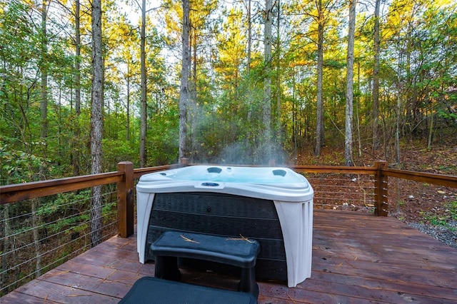 wooden terrace featuring a hot tub