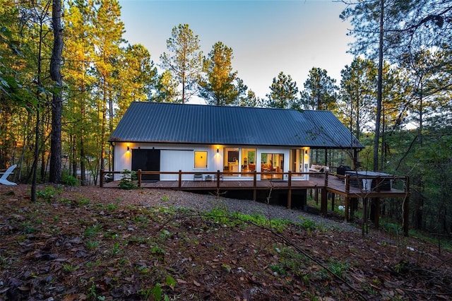 rear view of property with a deck