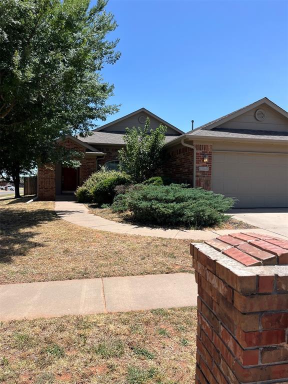 ranch-style home featuring a garage