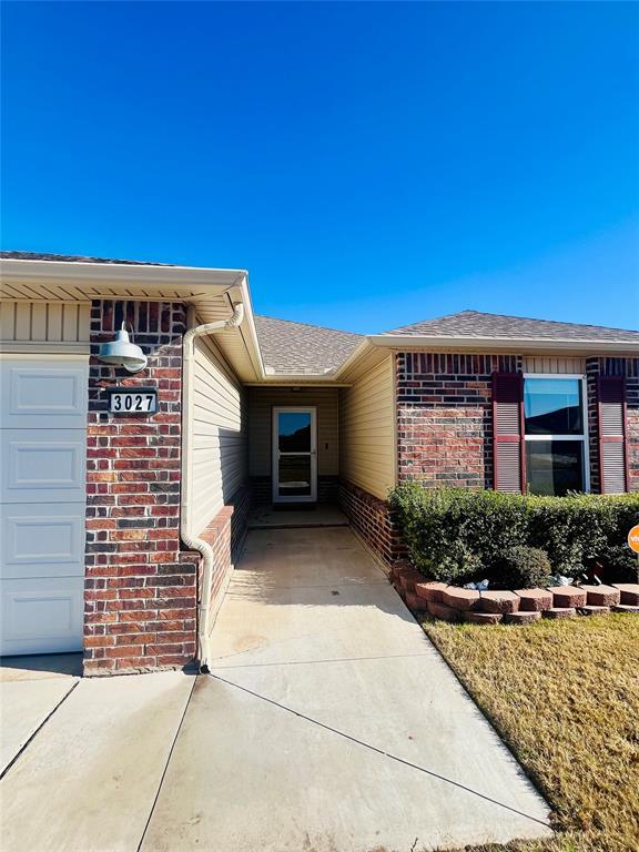 doorway to property featuring a garage