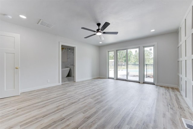 empty room with light hardwood / wood-style floors and ceiling fan