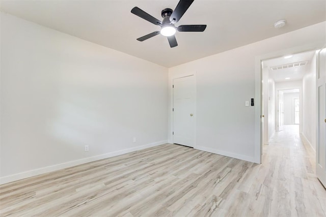 unfurnished room with light wood-type flooring and ceiling fan