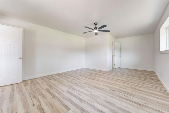 spare room featuring light wood-type flooring and ceiling fan