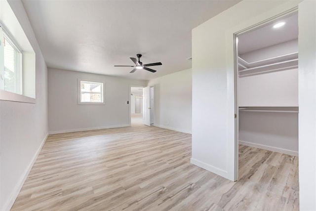 unfurnished bedroom featuring a closet, ceiling fan, and light hardwood / wood-style floors