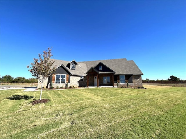 craftsman-style home with a front yard