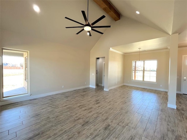 unfurnished living room with ceiling fan with notable chandelier, beam ceiling, crown molding, and high vaulted ceiling