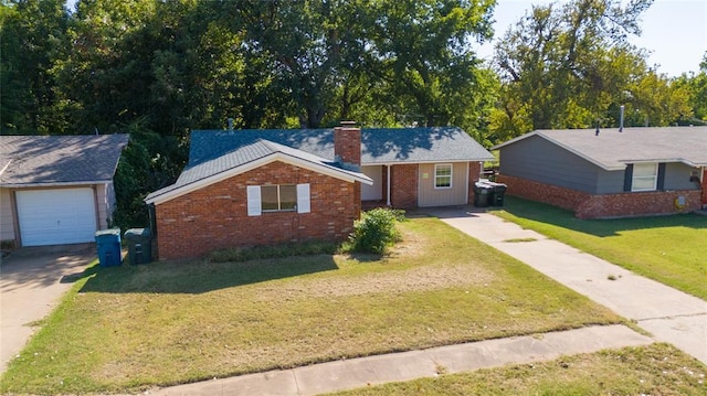 single story home with a garage and a front lawn