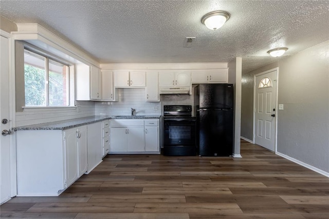 kitchen with light stone countertops, backsplash, black appliances, dark hardwood / wood-style floors, and white cabinetry