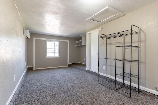 unfurnished bedroom featuring carpet flooring and a wall mounted AC