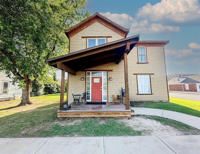 view of front of house with a front lawn and a porch