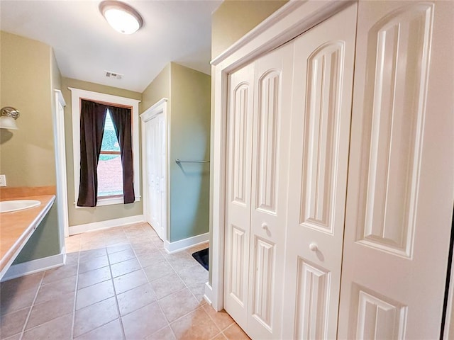 bathroom featuring tile patterned floors and vanity