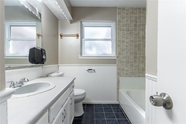 full bathroom featuring tile patterned flooring, vanity, shower / bathtub combination, and toilet