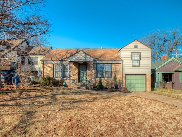 view of front facade with a garage and a front lawn