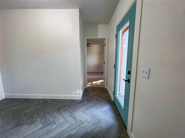 corridor with dark parquet flooring