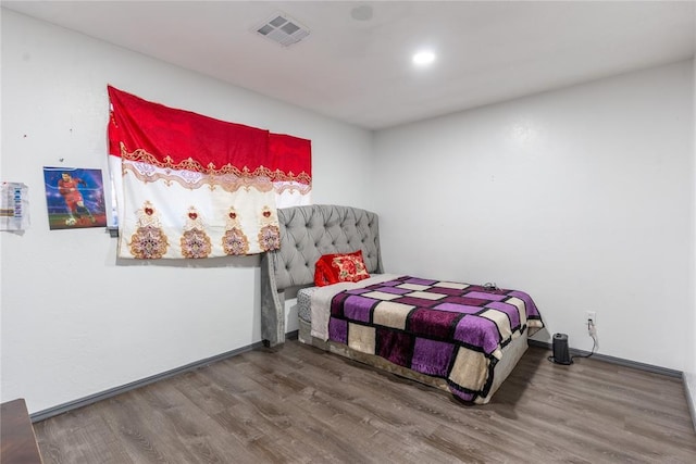 bedroom featuring wood-type flooring