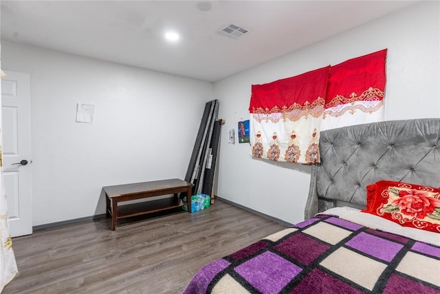 bedroom with wood-type flooring