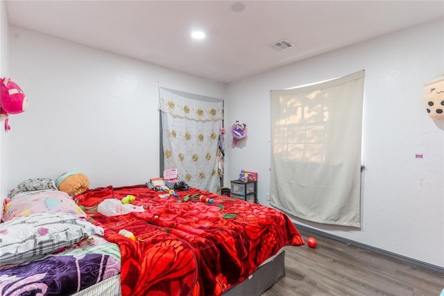 bedroom featuring wood-type flooring