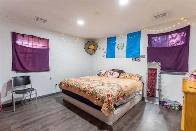 bedroom with hardwood / wood-style floors