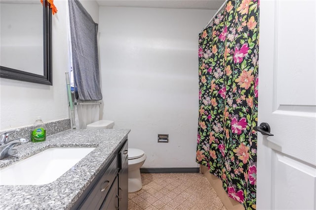 bathroom featuring toilet and vanity