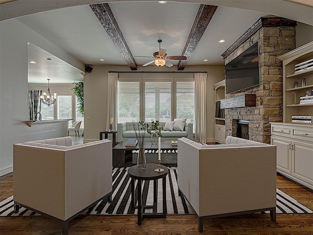 kitchen featuring beamed ceiling, a breakfast bar, and white cabinets