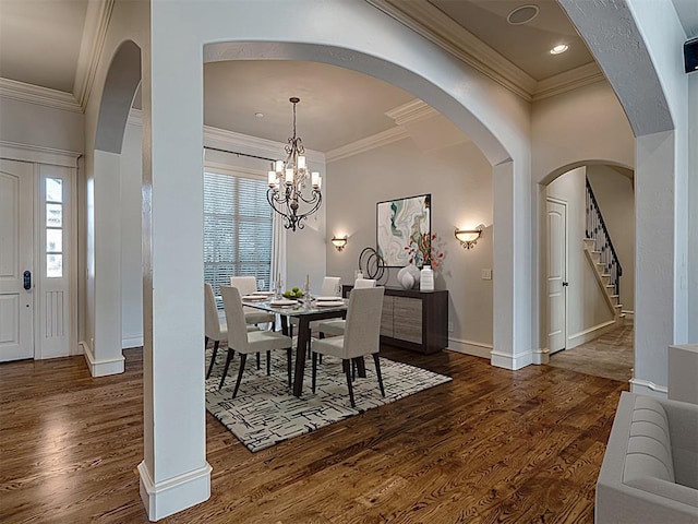 dining area with a chandelier, dark hardwood / wood-style floors, and plenty of natural light