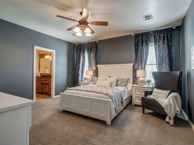 bedroom with carpet, ceiling fan, and ensuite bathroom