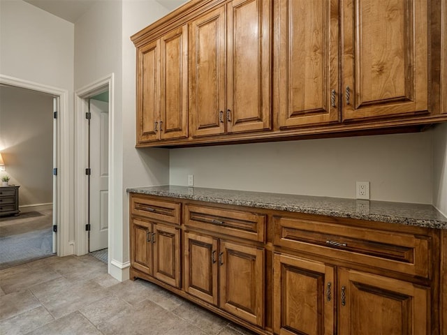 kitchen featuring dark stone countertops