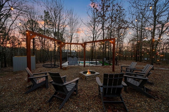 view of yard with a fire pit