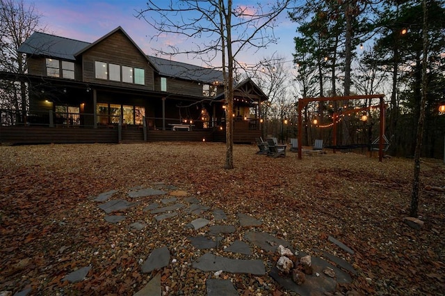 view of back house at dusk