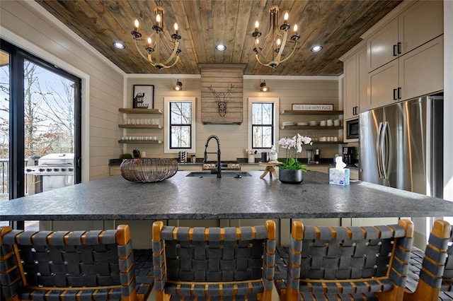 kitchen with open shelves, dark countertops, and wooden ceiling