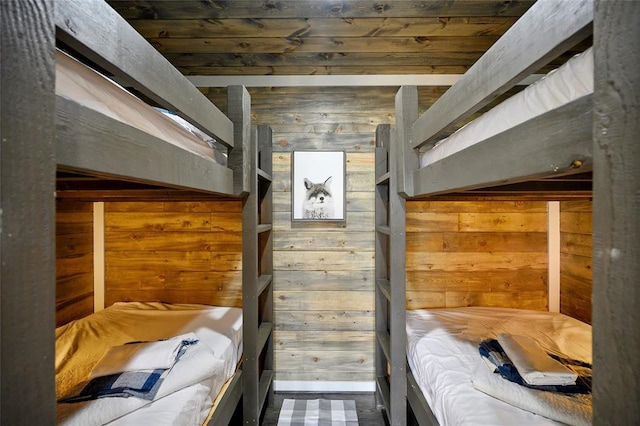 bedroom featuring wood walls