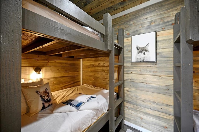 bedroom with wood walls