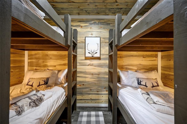 unfurnished bedroom featuring wooden walls