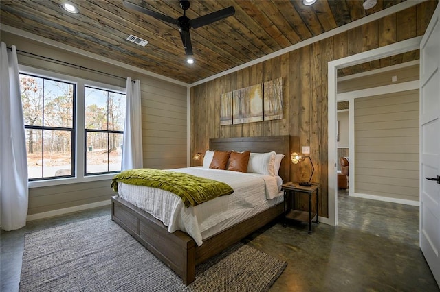 bedroom with finished concrete flooring, recessed lighting, visible vents, wood ceiling, and wooden walls