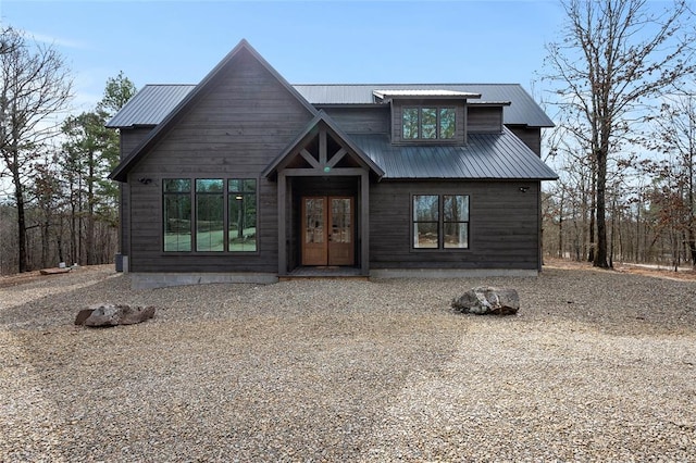 rustic home with metal roof and french doors