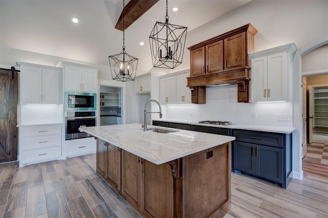 kitchen featuring white cabinets, stainless steel appliances, and sink